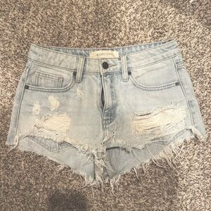 Ripped light wash jean cut off shorts